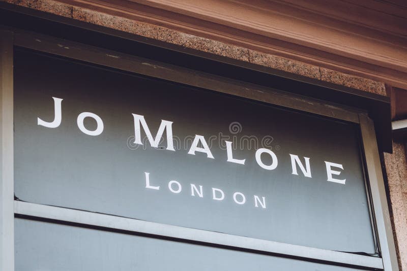 Jo Malone London brend sign on city street. Signboard logo of Jo Malone London, British perfume and scented candle brand shop, mall, boutique. Kiev, Ukraine - September 02, 2019, aroma, lux, vip, luxury, fragrance, outlet, retail, store, sale, fashion, interior, modern, display, man, woman, industry, commercial, customer, showroom, area, market, inside, lifestyle, design, business, detail, black, decor, elegant, light, luxurious, merchandising, retailer, traditional, showcase. Jo Malone London brend sign on city street. Signboard logo of Jo Malone London, British perfume and scented candle brand shop, mall, boutique. Kiev, Ukraine - September 02, 2019, aroma, lux, vip, luxury, fragrance, outlet, retail, store, sale, fashion, interior, modern, display, man, woman, industry, commercial, customer, showroom, area, market, inside, lifestyle, design, business, detail, black, decor, elegant, light, luxurious, merchandising, retailer, traditional, showcase