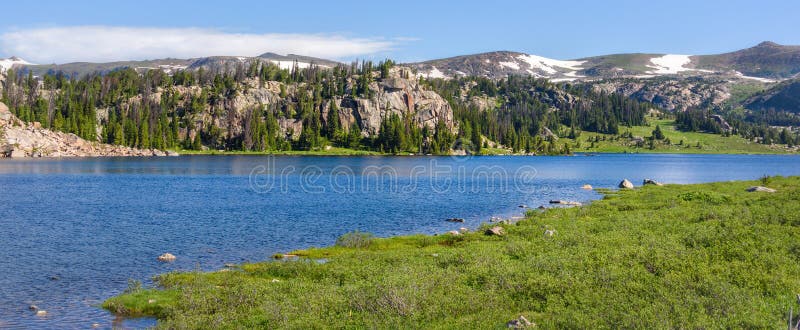 Panorama of an alpine lake along the Beartooth Highway. Yellowstone Park, Wyoming. royalty free stock images Panorama of an alpine lake along the Beartooth Highway. Yellowstone Park, Wyoming. royalty free stock images
