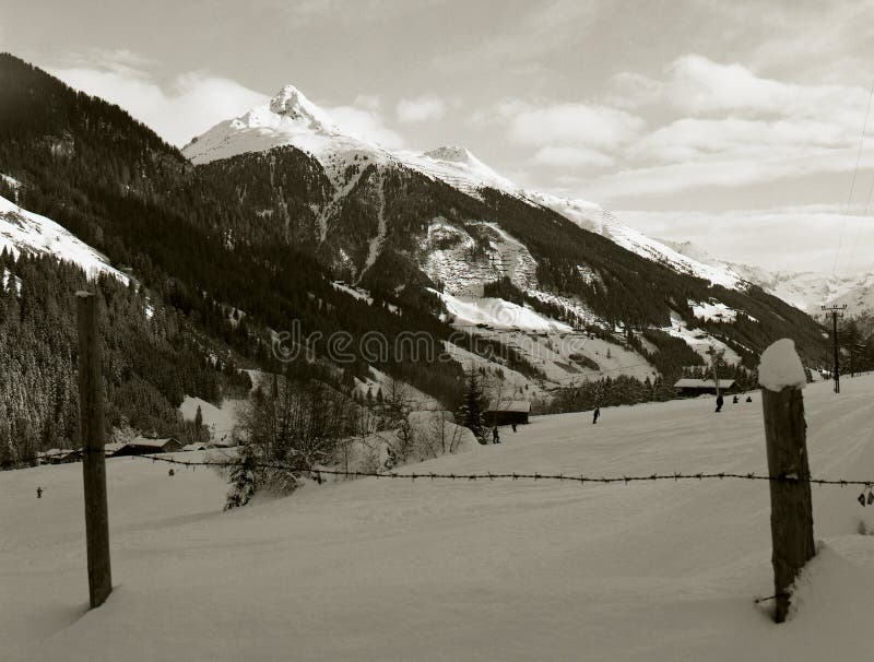 panorama of alpine peaks seen from behind the fence stock photo panorama of alpine peaks seen from behind the fence stock photo