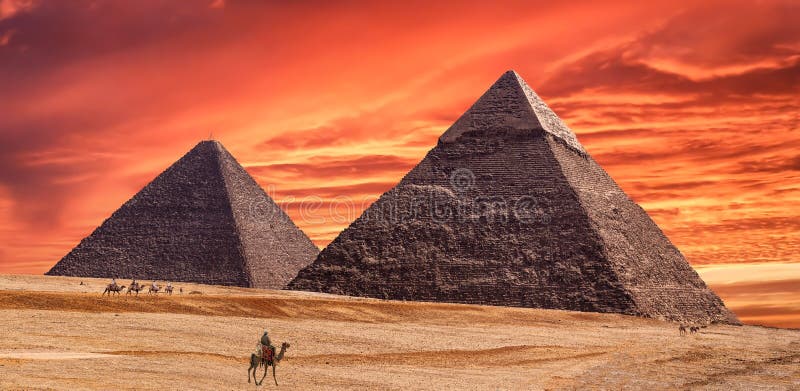 Panorama of the area with the great pyramids of Giza at amazing sunset, Egypt