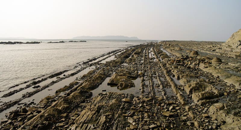 Panorama av den steniga kustNgapali stranden i Myanmar fotografering för bildbyråer Panorama av den steniga kustNgapali stranden i Myanmar fotografering för bildbyråer