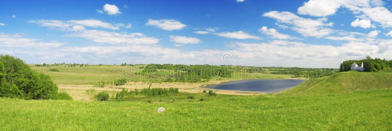 This is Panorama of beautiful green valley. Izborsk, Pskov region, Russia.
