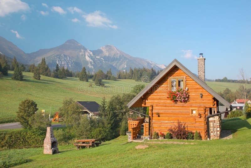 Panorama of Belianske Tatry mountains and the little blockhouse in Zdiar village