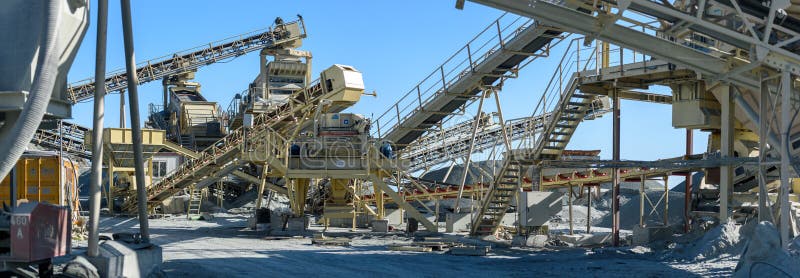 Panorama of conveyors and stone crushing machinery at gravel quarry