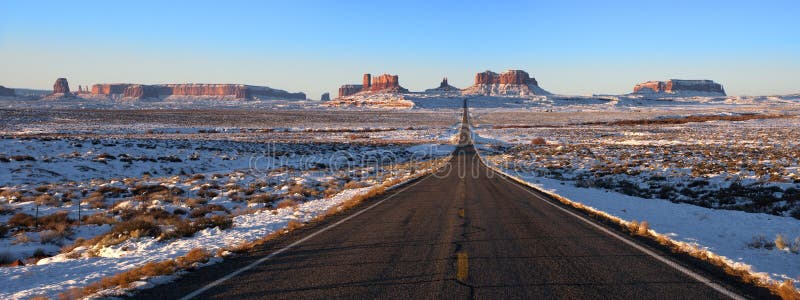 Road leading into Monument Valley navajo Indian Reservation Tribal Park. You've seen this image many times from other photographers but it is rare to capture the magic of the desert and mountains during a winter snow. This scene has been photographed many times but here is an opportunity to use a panorama of the mountains and high desert. Panoramic. Road leading into Monument Valley navajo Indian Reservation Tribal Park. You've seen this image many times from other photographers but it is rare to capture the magic of the desert and mountains during a winter snow. This scene has been photographed many times but here is an opportunity to use a panorama of the mountains and high desert. Panoramic.
