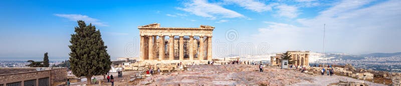 Panorama of Acropolis, Athens, Greece. It is a top tourist attraction of Athens. People visit the Ancient Greek ruins in the Athens center. Scenic view of the famous Parthenon on the Acropolis hill. Panorama of Acropolis, Athens, Greece. It is a top tourist attraction of Athens. People visit the Ancient Greek ruins in the Athens center. Scenic view of the famous Parthenon on the Acropolis hill