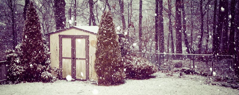 An old shed is the focus of this photo of a snow covered yard with woods in the background. Vintage colortone applies. An old shed is the focus of this photo of a snow covered yard with woods in the background. Vintage colortone applies.