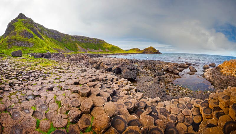 Panoramic view at the rocky coastline of the Giantâ€™s Causeway in Northern Ireland. Panoramic view at the rocky coastline of the Giantâ€™s Causeway in Northern Ireland.