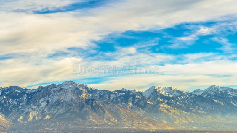 Panorama Panorama of downtown Salt Lake City against mountain and vibrant cloudy sky