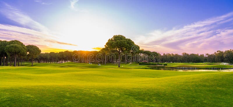 Panorama of Golf Course at Sunset with Beautiful Sky. Scenic Panoramic