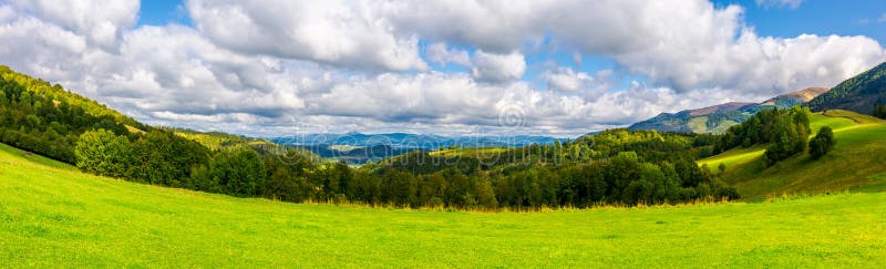 Panorama of green alpine meadow in autumn stock photography Panorama of green alpine meadow in autumn stock photography