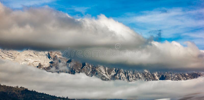 panorama of the lake of Santa Croce seen from the village of Alpago beautiful areas surrounded by mountains at an hour from the stock image panorama of the lake of Santa Croce seen from the village of Alpago beautiful areas surrounded by mountains at an hour from the stock image