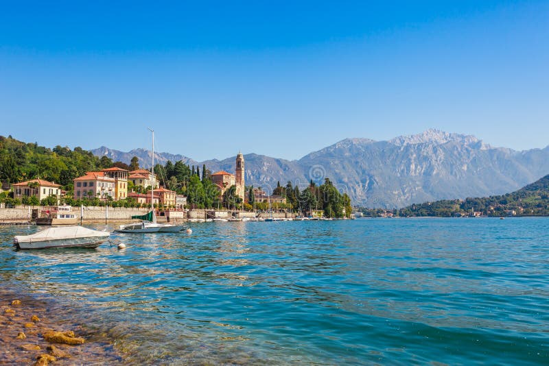 Panorama landscape on beatiful Lake Como in Tremezzina, Lombardy, Italy. Scenic small town with traditional houses and clear blue royalty free stock photography Panorama landscape on beatiful Lake Como in Tremezzina, Lombardy, Italy. Scenic small town with traditional houses and clear blue royalty free stock photography