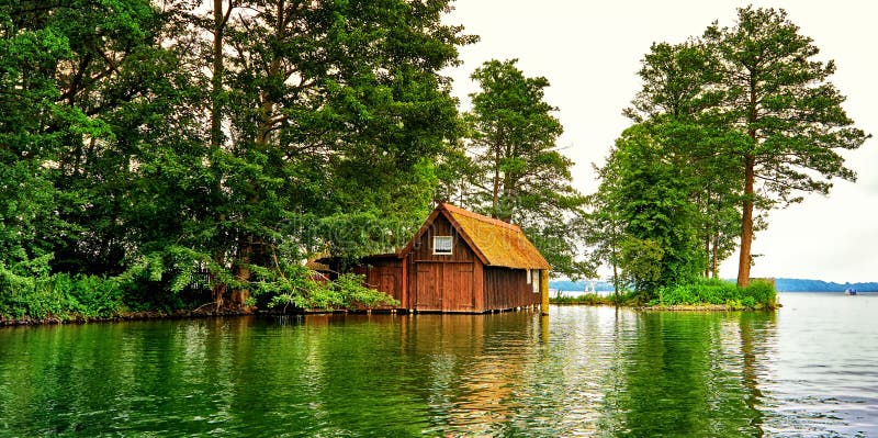 Panorama with old wooden boathouse in the sunset. Mecklenburg-Vorpommern, Germany royalty free stock image Panorama with old wooden boathouse in the sunset. Mecklenburg-Vorpommern, Germany royalty free stock image