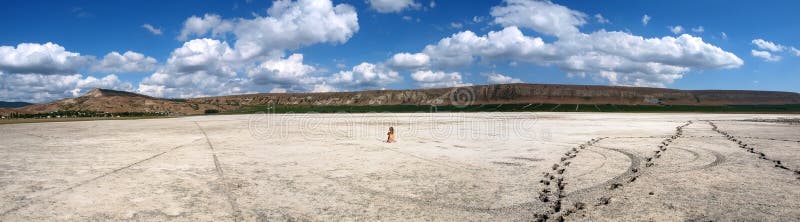 Panorama of a salt lake with a naked girl