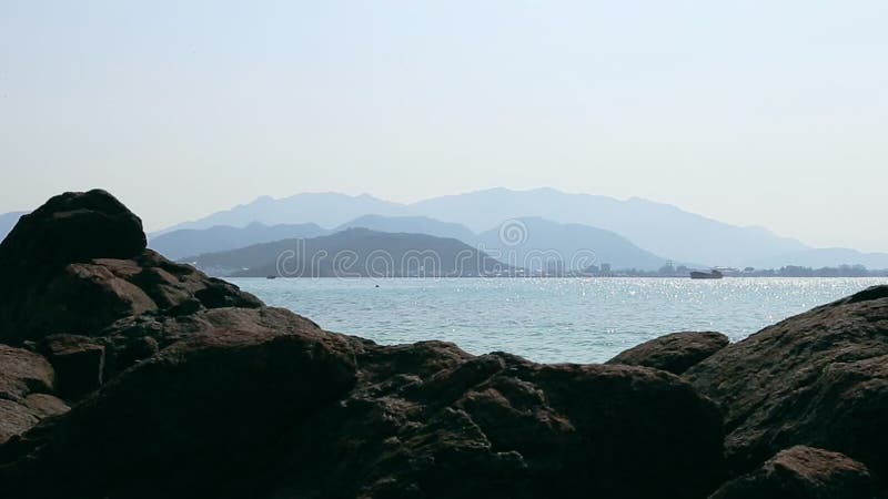 Panorama of seascape with stones blue ocean and skyline sity