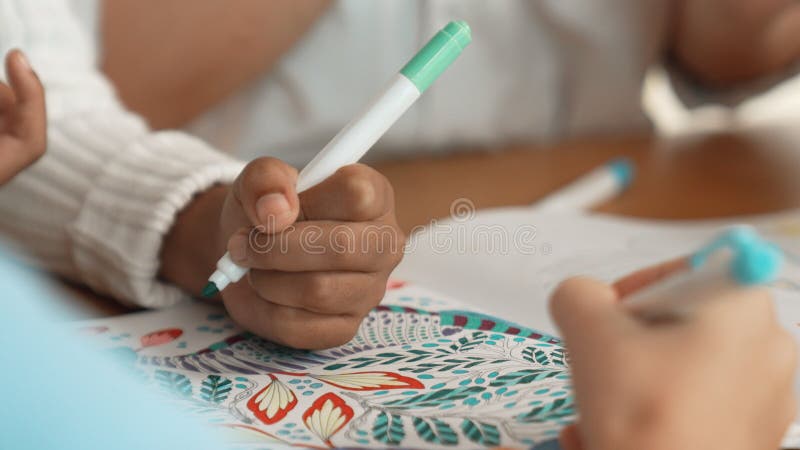 Panorama shot of student hand drawing and coloring by using marker. Erudition. royalty free stock photo