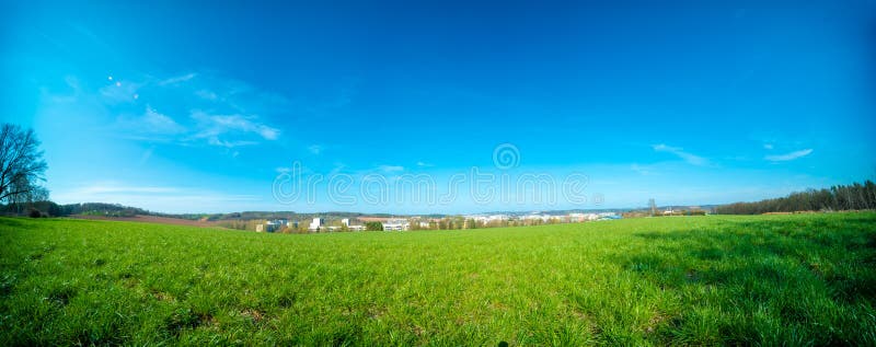 Panorama of spring arable field stock photos.