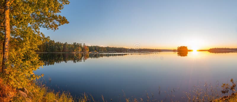 Panorama of a sunset on a lake stock photos Panorama of a sunset on a lake stock photos