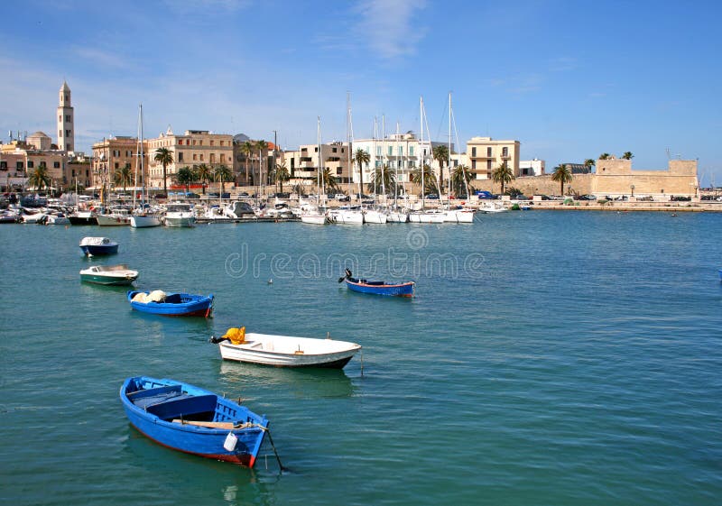 Panorama of Bari old town with the bell tower of the cathedral and the blue sea with boats. Panorama of Bari old town with the bell tower of the cathedral and the blue sea with boats