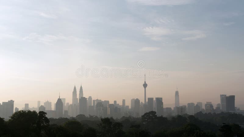 Panorama view of beautiful kuala lumpur cityscape skyline in the hazy or foggy morning enviroment royalty free stock photography Panorama view of beautiful kuala lumpur cityscape skyline in the hazy or foggy morning enviroment royalty free stock photography