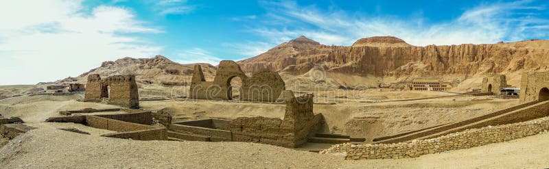 A panorama view on the east bank of the Nile at Luxor, Egypt past ancient ruins towards the Hatshepsut temple