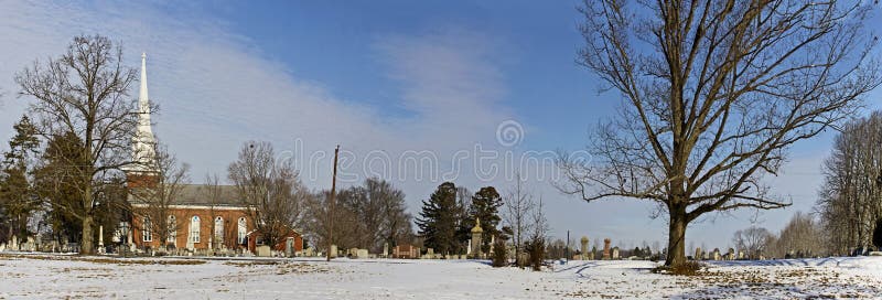 Panorama of Vintage Church and Graveyard in Winter