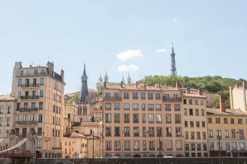 Facade of the old buildings of the vieux Lyon Old Lyon in France facing Colline de Fourviere Hill on the riverbank of the Rhone