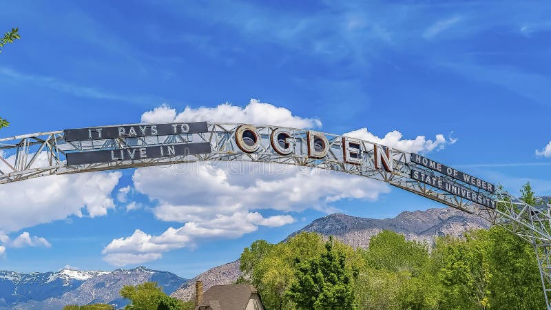 Panorama Welcome arch at the city of Ogden Utah against vivid blue sky and puffy clouds stock photography Panorama Welcome arch at the city of Ogden Utah against vivid blue sky and puffy clouds stock photography