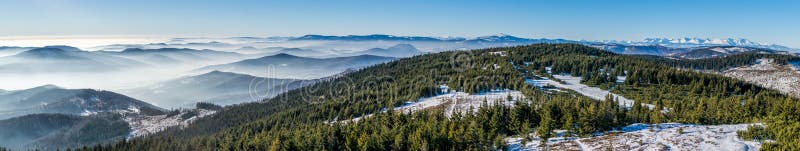 Panorama of winter High Tatras and many small hills