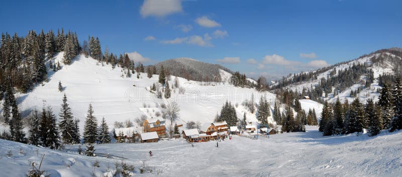 Panorama of winter landscape of Carpathians with cottages