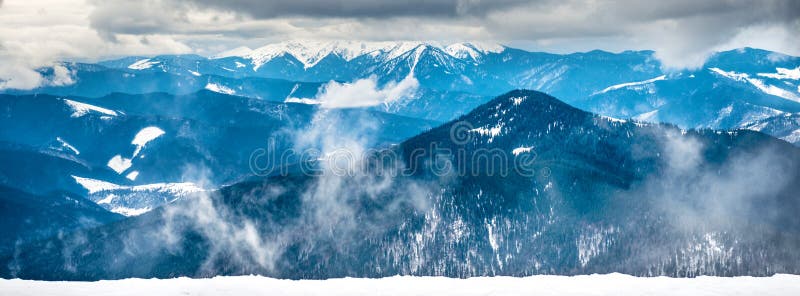 Panorama of winter mountains in snow