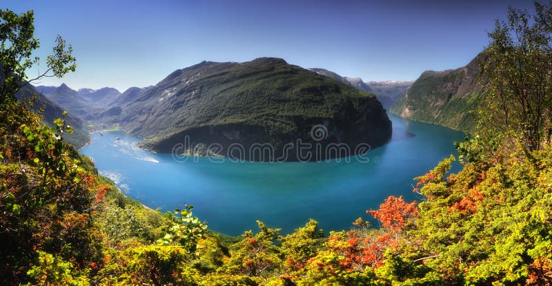 Panoramic aerial landscape of Geiranger fjord in Norway from mountain viewpoint. High resolution panorama