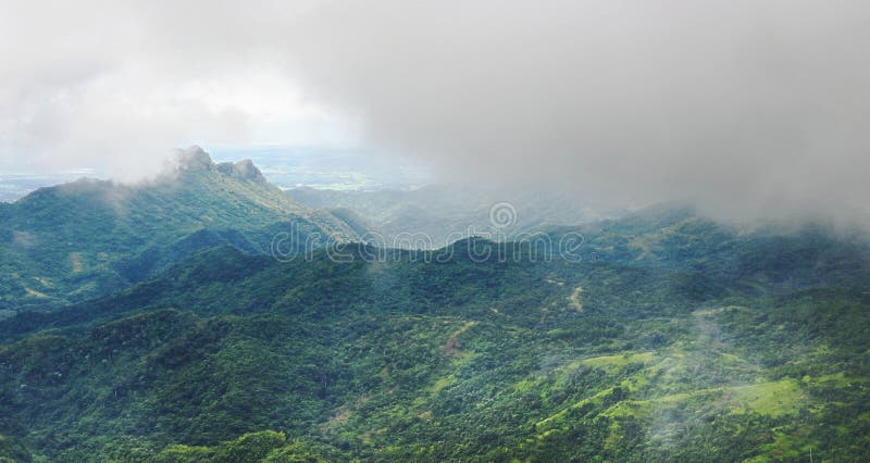 Panoramic beautiful natural scenery of mist over green mountain stock photo Panoramic beautiful natural scenery of mist over green mountain stock photo