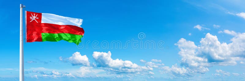 Oman Flag - state of Asia, flag waving on a blue sky in beautiful clouds - Horizontal banner royalty free stock photos