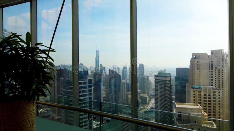 Panoramic skyline and buildings from glass window. Stock. Magnificent view over the city from apartment