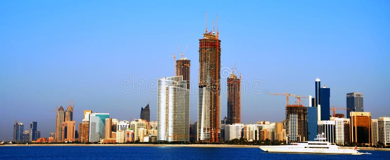 A panoramic view of the skyline of oil rich Abu Dhabi, UAE. Evidently the global crisis has not affected Abu Dhabi and the construction boom carries on in the UAE. A panoramic view of the skyline of oil rich Abu Dhabi, UAE. Evidently the global crisis has not affected Abu Dhabi and the construction boom carries on in the UAE.