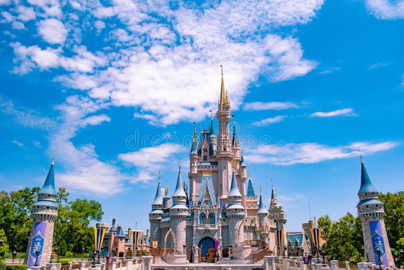 Panoramic view of Cinderella`s Castle on cloudy lightblue sky background  in Magic Kingdom at Walt Disney World Resort 2