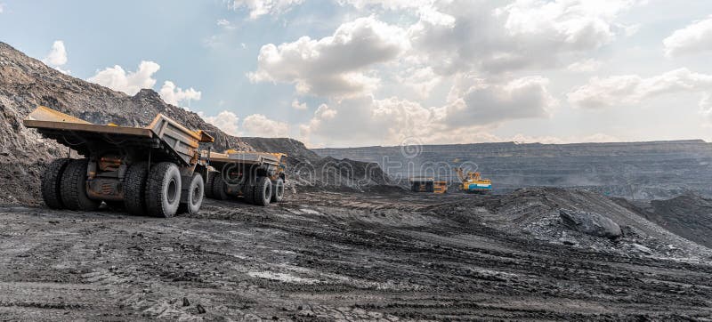 Panoramic view of coal mine. Open pit mine industry, big yellow mining truck for coal quarry. Open coal mining stock image