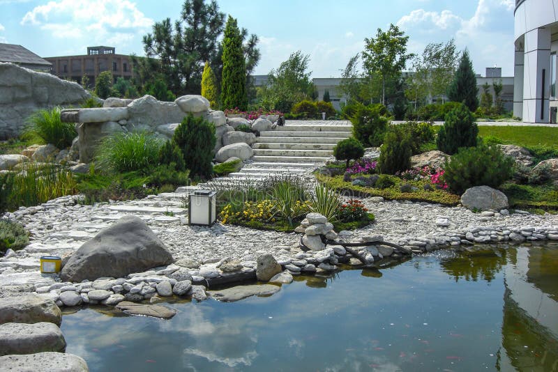 View out the pond to scenery style rock garden.