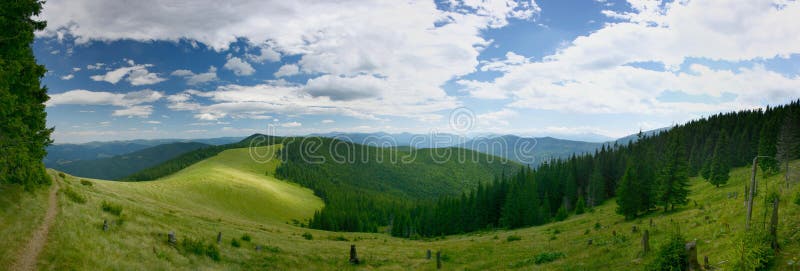 Panoramic view of the green mountain valley in the mountains