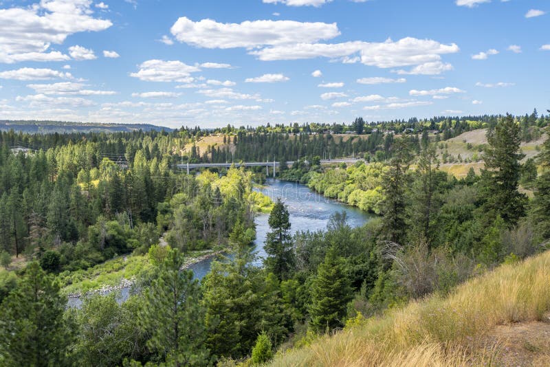 Panoramic view of Kayakers enjoying a summer day on the Spokane River near Nine Mile in Spokane, Washington. royalty free stock photo Panoramic view of Kayakers enjoying a summer day on the Spokane River near Nine Mile in Spokane, Washington. royalty free stock photo