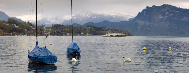 Panoramic view of the lake Lucerne on a cloudy spring day. Town of Luzern, Switzerland.
