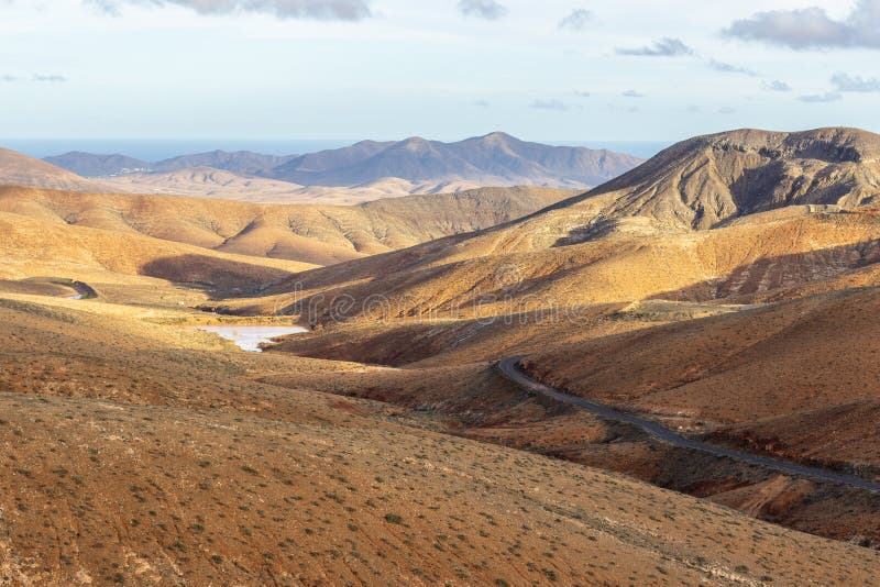 Panoramic view at landscape from viewpoint mirador astronomico de Sicasumbre between Pajara and La Pared on canary island. Fuerteventura, Spain royalty free stock image Panoramic view at landscape from viewpoint mirador astronomico de Sicasumbre between Pajara and La Pared on canary island. Fuerteventura, Spain royalty free stock image