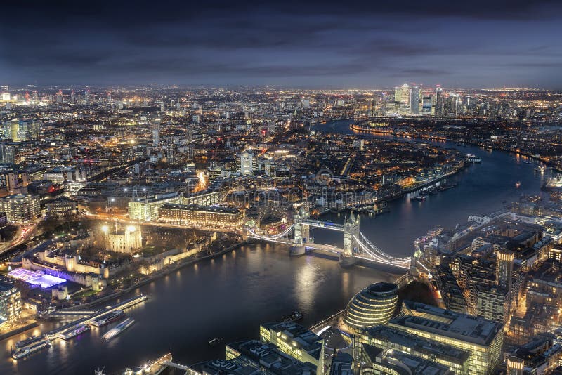 Panoramic view of London: from the Tower Bridge to the financial district Canary Wharf during evening time. Panoramic view of London: from the Tower Bridge to the financial district Canary Wharf during evening time