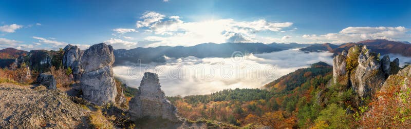 Panoramic view of mountain landscape with foggy valley