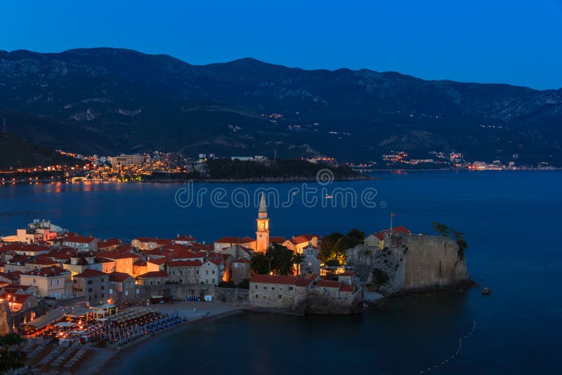 Panoramic view of old town Budva at sunset, blue hours and night. stock images Panoramic view of old town Budva at sunset, blue hours and night. stock images