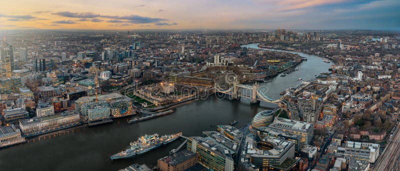 Panoramic view over the skyline of London during sunset time: from the Tower Bridge along the Thames to Canary Wharf