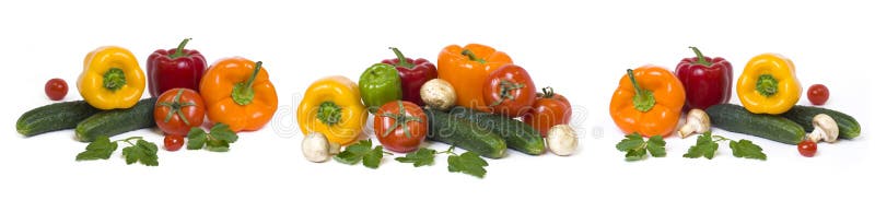 Panoramic view of the red yellow and orange peppers with tomatoes on a white background. Cucumbers with colorful peppers in compos