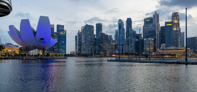 Panoramic view of Singapore city skyscrapers after sunset stock images